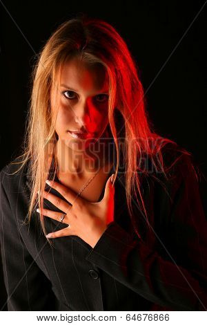Portait of a beautiful girl made with ring light and some red backlight