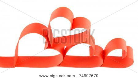 Heart shaped red paper ribbon isolated on white