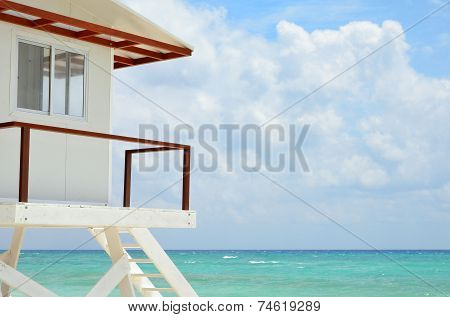 White Lifeguard House On A Beach