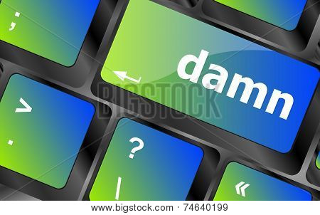 Close-up Computer Keyboard Keys With Damn Word