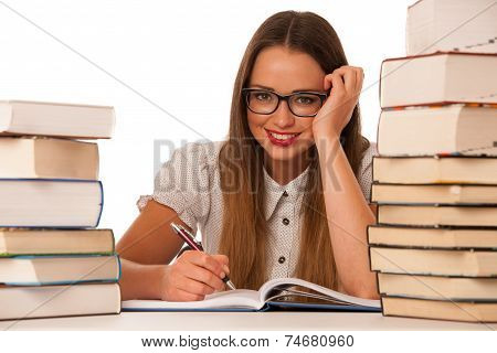 Happy Asian Caucasian Girl Lerning In Study Woth Lots Of Books On The Table