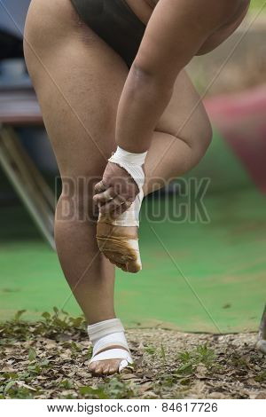 A bandaged wrestlers feet during practice in Japan