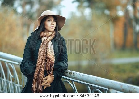 Girl In Hat Standing On The Bridge