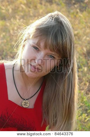 Girl with slavic pagan swastika (religious symbol)