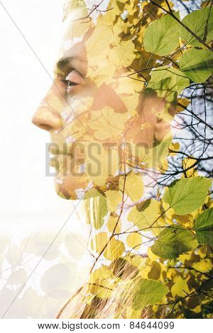 Double exposure of woman combined with photograph of leaves