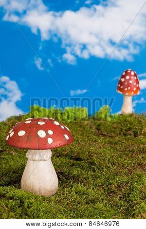 Fairytale background with agaric toadstools and moss