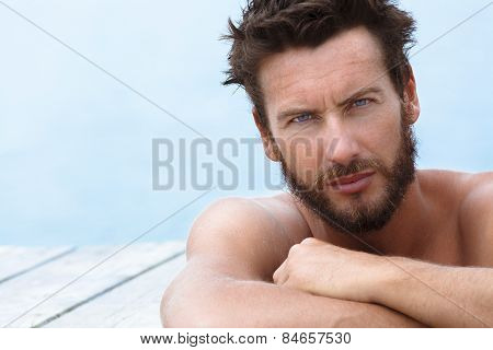 Handsome Man With No Shirt Posing At The Sea
