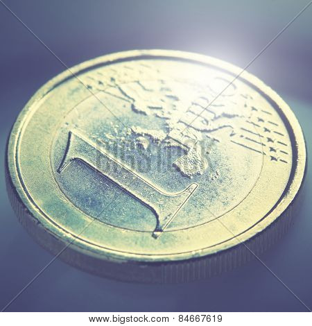 Euro coin close-up. Shallow DOF! Retro style filtred image