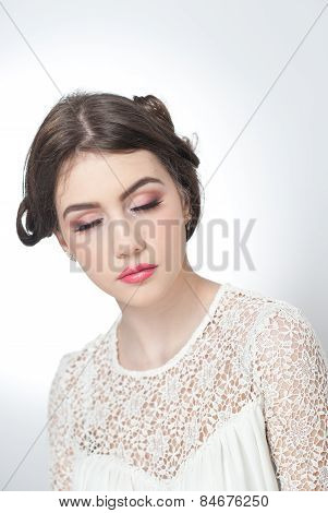Hairstyle and make up - beautiful young girl art portrait with closed eyes. Genuine natural brunette