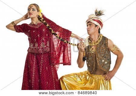 Indian couple. Portrait of beautiful Indian family in traditional costume standing isolated on white background. Indian husband and wife model.
