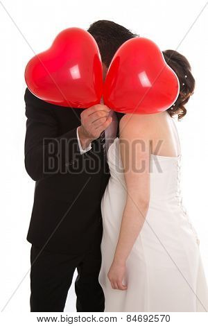 Happy bridal pair with thumbs up. Lucky couple get married.