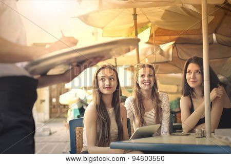 Girls ordering a meal at the restaurant