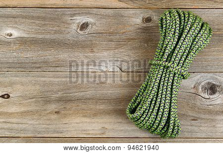 New Nylon Climbing Rope On Rustic Wooden Boards