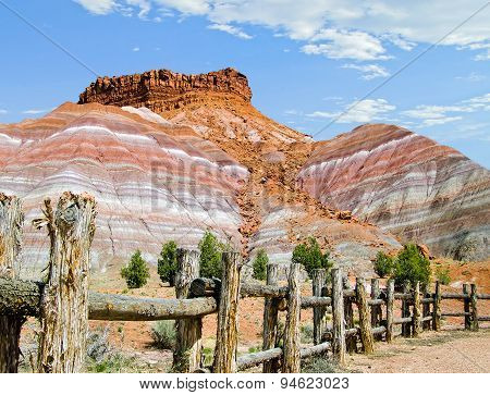 Rustic Fence And Colorful Cliffs