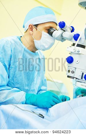 surgeon team in uniform in front of eye vision surgery operation room at medical clinic