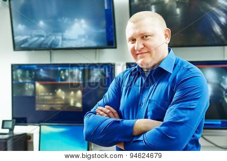security guard watching video monitoring surveillance security system