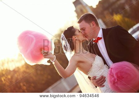 Bride And Groom Holding A Candy Floss