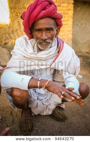 GODWAR REGION, INDIA - 14 FEBRUARY 2015: Elderly Rabari tribesman with red turban and blanket around the shoulders. Rabari or Rewari are an Indian community in the state of Gujarat.