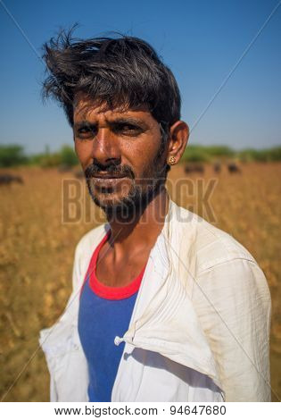 GODWAR REGION, INDIA - 14 FEBRUARY 2015: Young Rabari shepherd with no turban. Rabari are an Indian community in the state of Gujarat.