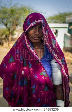 GODWAR REGION, INDIA - 13 FEBRUARY 2015: Rabari tribeswoman in sari decorated with traditional upper-arm bracelets. Rabari or Rewari are an Indian community from Gujarat.