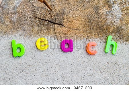 The Word Beach Laid Sand