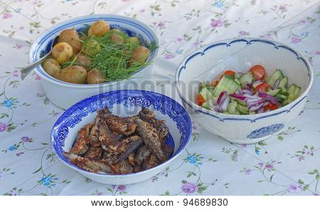 Three Bowles With Herring, Potato And Sallad