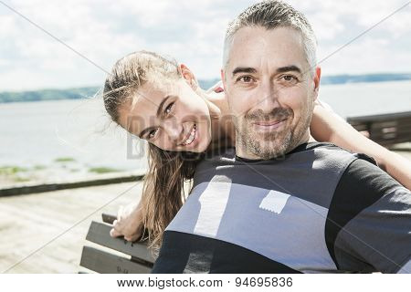 Father with his daughter at sea getting good time