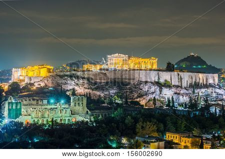 Parthenon and Herodium construction in Acropolis Hill in Athens, Greece shot in blue hour with