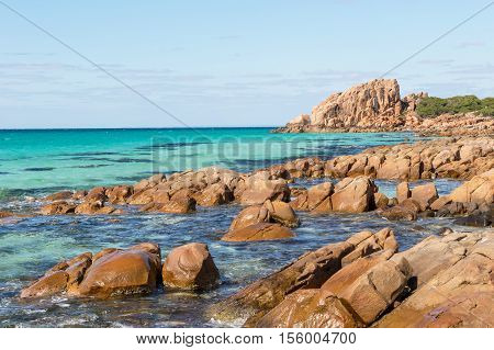 Castle Rock near Dunsborough in Western Australia is a massive chunk of orange granite standing tall at the end of beautiful Castle Bay.