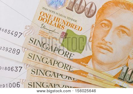 Close up of a heap of Singapore money and background texture or pattern