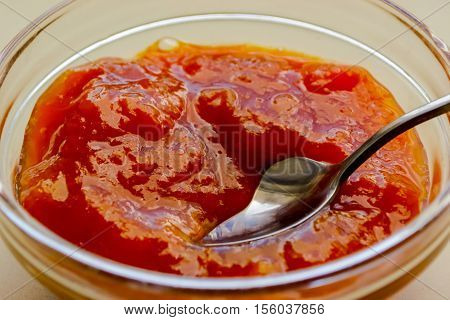 top view of fruity apricot jam on a sauser