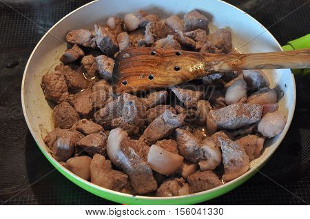 Afelia. Cypriot national dish of marinated and stewed pork in aromatic spices.