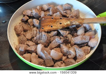 Afelia. Cypriot national dish of marinated and stewed pork in aromatic spices.