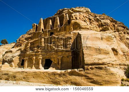Photo of the Obelisk Tomb and Bab As-Siq Triclinium ruins ancient Nabataean city Petra, Jordan near entrance to canyon Siq. Explore and adventure concept.