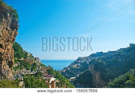 The rocks and slopes of Amalfi Coast are famous for the beauty of nature and local resorts Positano Italy.