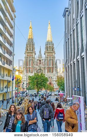 KIEV UKRAINE - SEPTEMBER 18 2016: The narrow pass between the houses leads to the St Nicholas Roman Catholic Cathedral on September 18 in Kiev.