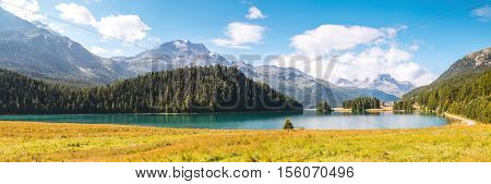 Great view of the azure pond Champfer in alpine valley. Popular tourist attraction. Picturesque and gorgeous scene. Location Swiss alps, Silvaplana village, district of Maloja, Europe. Beauty world.
