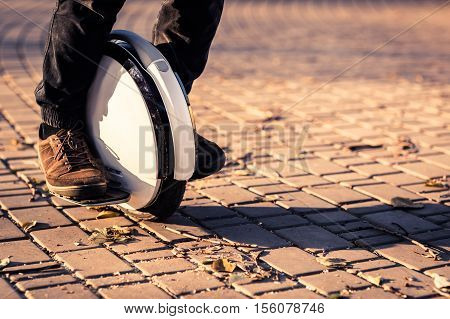 Man legs mono wheel personal electrical transport street outdoor