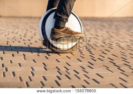 Man legs mono wheel personal electrical transport street outdoor