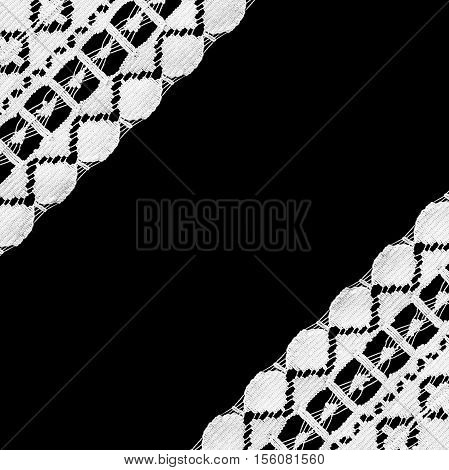 White lace as a frame on black background