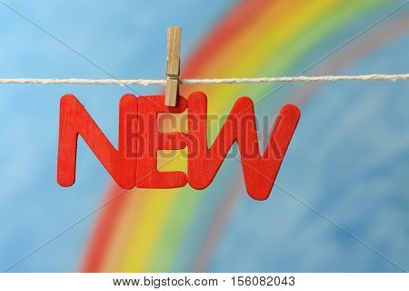 Red letters spelling the word new to illustrate the concept of a new beginning, opportunity and change.
