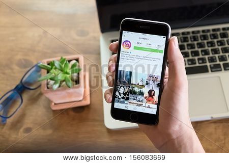 CHIANG MAI THAILAND - AUGUST 02 2016: A man hand holding iphone with new logo of instagram application. Instagram is largest and most popular photograph social networking.
