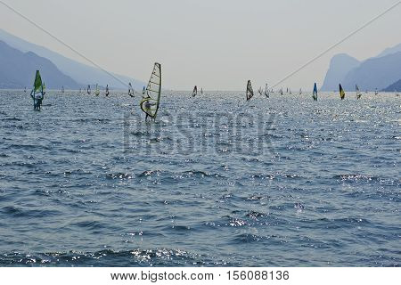 Torbole - Nago, Lago di Garda (Lago Benaco), Italy - August 11, 2015: A windsurfing on Lake Garda in Torbole resort.