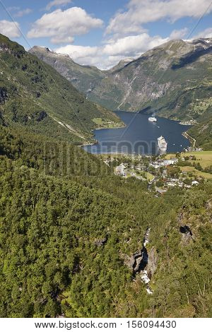 Norwegian fjord landscape. Geiranger village and forest. Cruise travel. Tourism