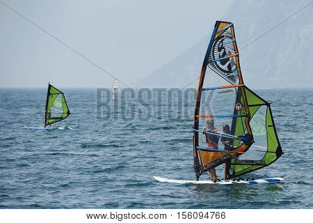 Torbole - Nago, Lago di Garda (Lago Benaco), Italy - August 11, 2015: A windsurfing on Lake Garda in Torbole resort.