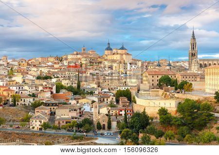Old city of Toledo with Primate Cathedral of Saint Mary, churches of San Ildelfonso, San Roman and Santo Tome at sunset, Castilla La Mancha, Spain.