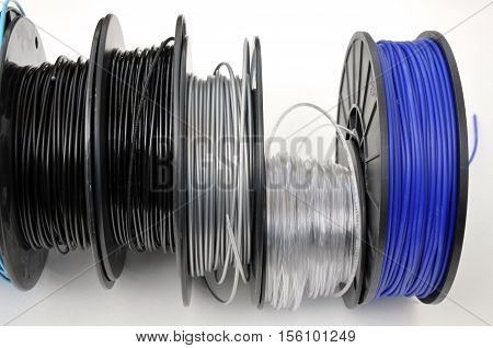 Multiple 3d printing filament spools in colors