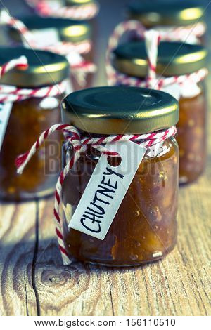 Onion pineapple chutney on rustic wood retro