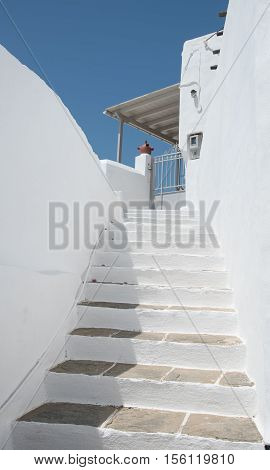 Traditional Greek island white stairs leading to the house entrance at the Island of Sifnos in Greece