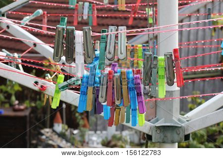 Close up of a colored clothespins on a clothesline